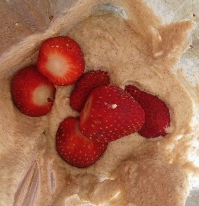 Mixing in Strawberries to Macadamia Nut Porridge