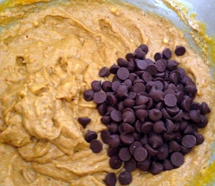 MixingMixing in Chocolate Chips into Vegan Pumpkin Banana Chocolate Chip Muffin Batter